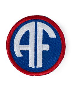 This view shows the front of the badge. Thumb.
