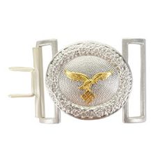 Front view of oval shaped silver belt buckle with golden eagle in the middle