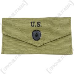 Front of khaki canvas American Khaki First Aid Pouch with one black popper style button closure. The closure flap has U.S. stamped in black in the middle