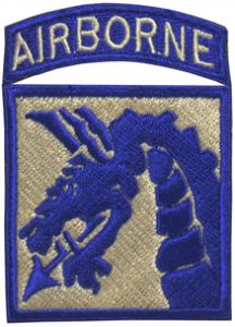 Off white embroidered square patch with blue dragon's head facing right, and the square outlined in blue. Above and attached to the square is a blue arch with AIRBORNE embroidered in white.