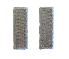 Front of pair of grey silver coloured, woven, horizontal First Lieutenant Officer Rank insignia