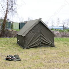 Green tent in a field