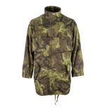 Front view of Original Czech Field Jacket in Model 95 camo, with two large chest pockets, two large hip pockets, an arm pocket on the upper of each arm. There is a Czech flag on the flap of the pocket on the left arm, and a patch featuring a parachute on 