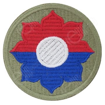 Circular khaki green embroidered insignia with red and blue flower in the middle - 9th Infantry Division