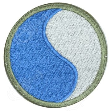 Circular embroidered half blue and half white insignia with khaki green outline - 29th Infantry Division
