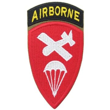 Shield shaped embroidered red patch with white plan and parachute silhouette in the middle, with a black embroidered arch attached to the top with AIRBORNE in yellow