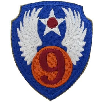 Blue shield shaped embroidered insignia with orange circle and the number 9 in red in the middle, with white wings - US 9th Airforce Badge/Patch