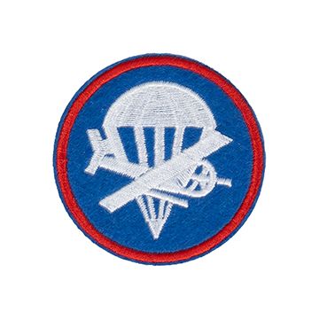 Circular Officers Airborne Garrison Cap Patch showing a plane and parachute in white on blue background, with red outline running around the outer of the badge