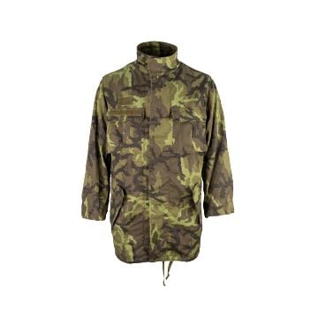 Front view of Original Czech Field Jacket in Model 95 camo, with two large chest pockets, two large hip pockets, an arm pocket on the upper of each arm. There is a Czech flag on the flap of the pocket on the left arm, and a patch featuring a parachute on 
