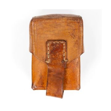 Top view of front of tan leather Original Serbian Army Mag Pouch with brass popper-style button underneath