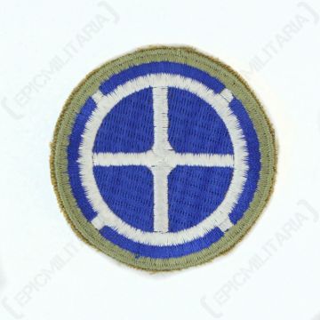 Circular embroidered khaki green insignia with blue circle in the middle and white detail - 35th Infantry Division