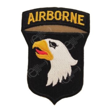 Shield shaped dark brown embroidered patch with right-facing eagle head, white with black eye, yellow beak, and red tongue. Attached to the top of the shield is a dark brown arch with AIRBORNE in golden yellow