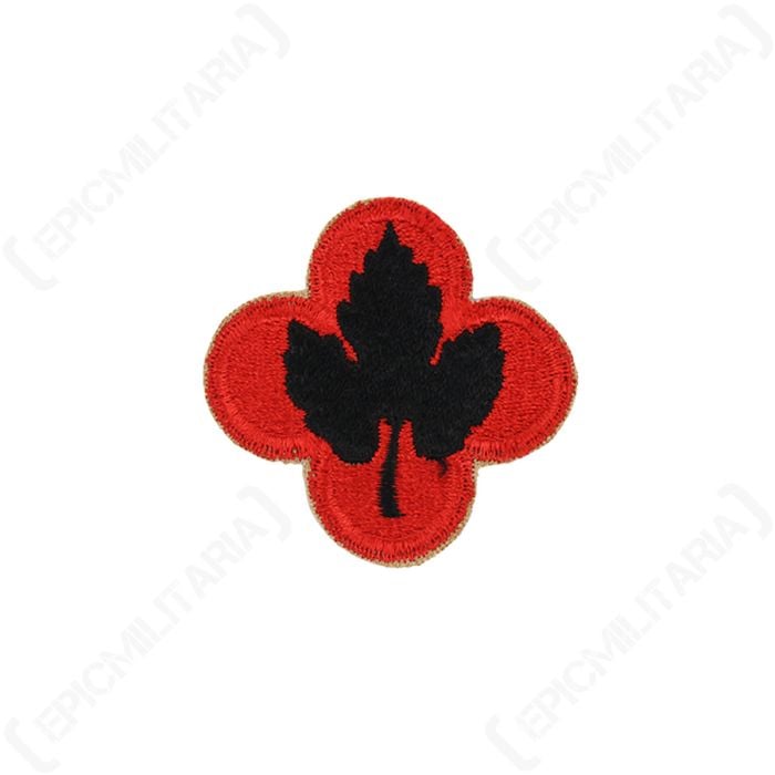 Front view of red clover-shaped embroidered patch with black grape leaf in the middle