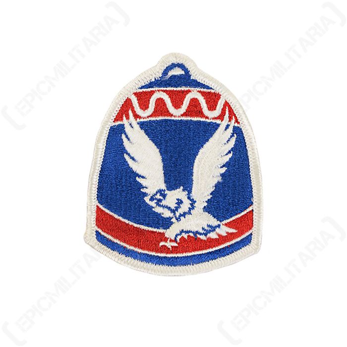Front view of bell-shaped embroidered patch with blue background, featuring two red banners, one along the top and one along the bottom, and a white eagle in the centre