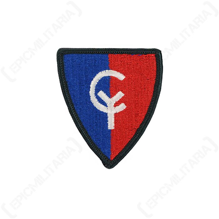 Front view of shield-shaped embroidered patch, with a dark green outline. The left half is blue and the right half is red, with the letters 'CY' in the centre