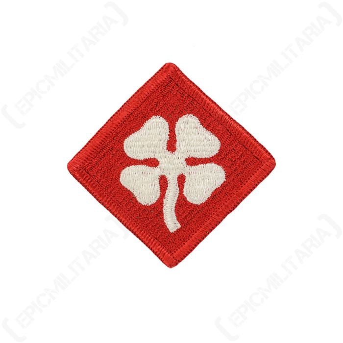 Front view of diamond-shaped, red embroidered patch with a white cloverleaf in the centre