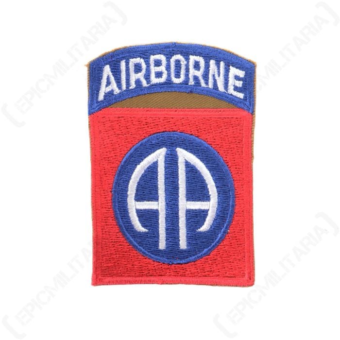 Red embroidered square with a blue circle in the middle with white AA inside. Attached to the top of the square is a blue arch with AIRBORNE embroidered in white