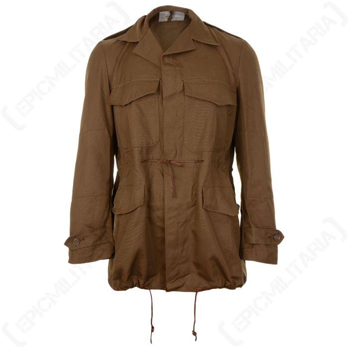 Front view of nutria brown colour field jacket, with a large chest pocket and flap on each side, and a large hip pocket with flap on each side. There is a brown rope drawstring knotted around the middle. The front is buttoned up with a flap over the butto
