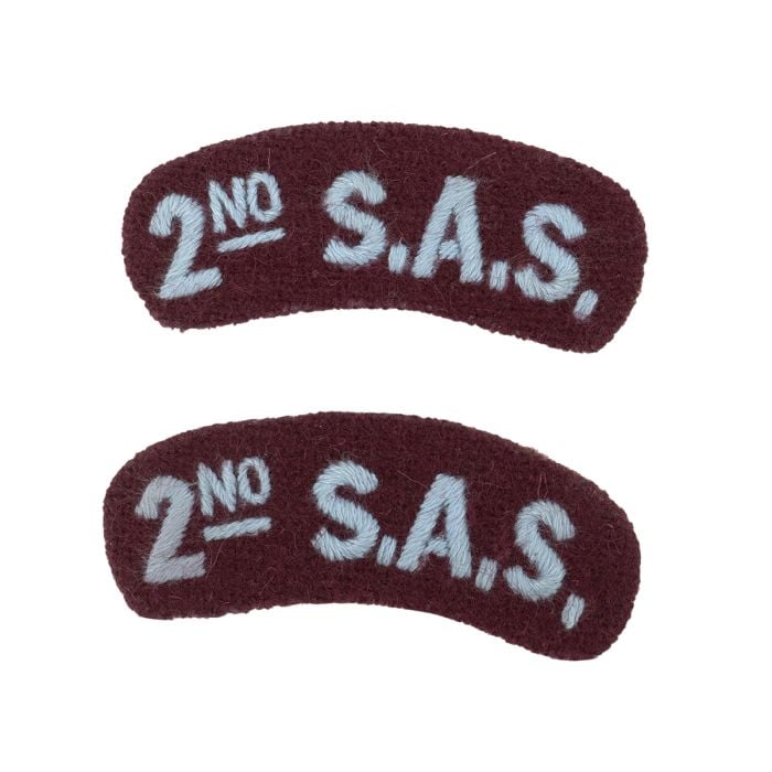 A front view of a pair of WW2 2nd SAS Shoulder Titles.