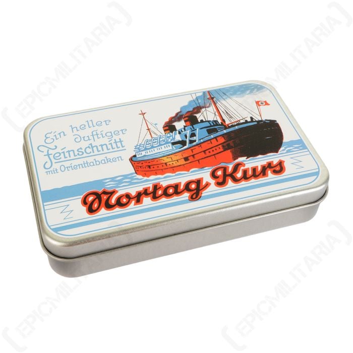 Top down view of a rectangular steel tobacco tin with an illustration of a red and blue ship on the ocean on the lid, with blue and red German text