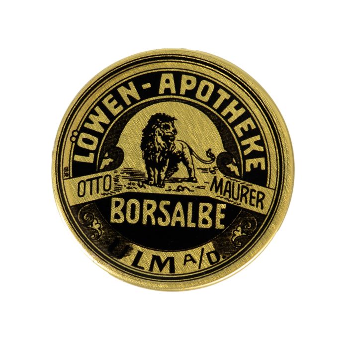 This view shows the front of the skin balm tin.