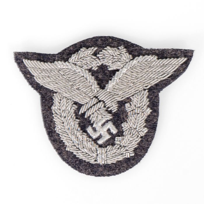 This view shows the front of the Luftwaffe Bullion Pilot Badge - Blue Grey Backing.