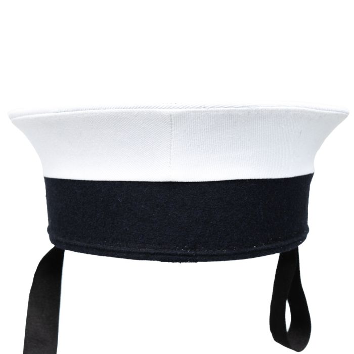 A side-on view of a WW2 British Royal Navy Ratings Cap, with the silk tally showing. 