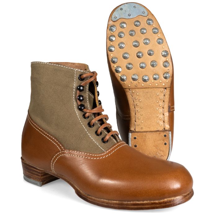 A pair of WW2 German DAK Low Boots. One is standing up to show off the hobnailed sole. The other is facing side-on to the camera.