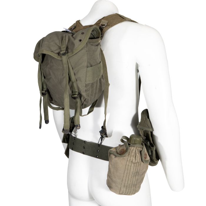 This shows a mannequin wearing the Greek Army M56 7-piece Webbing set from the side.