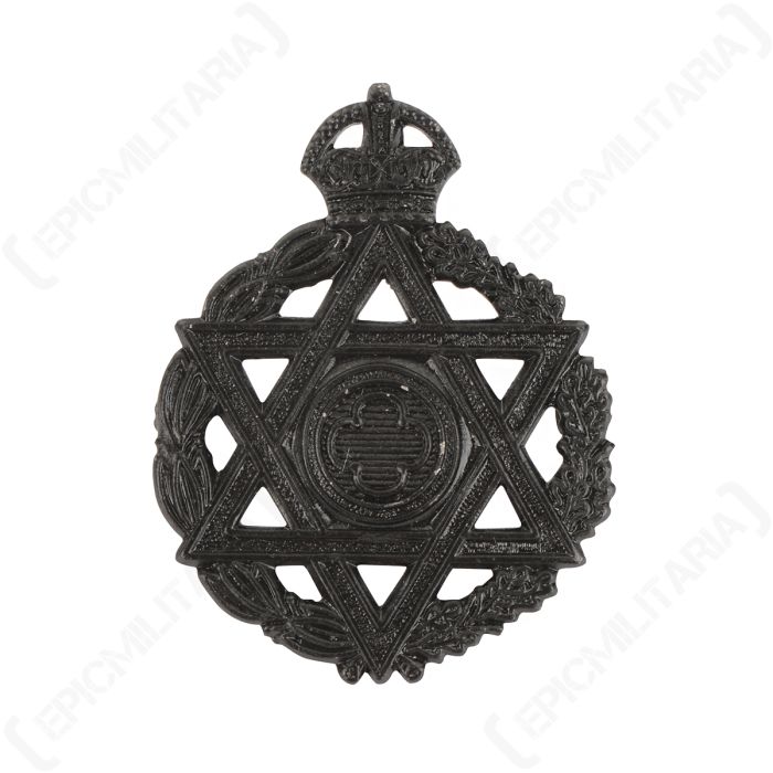 Front of black coloured British Jewish Chaplain cap badge featuring the Star of David surrounded by a wreath
