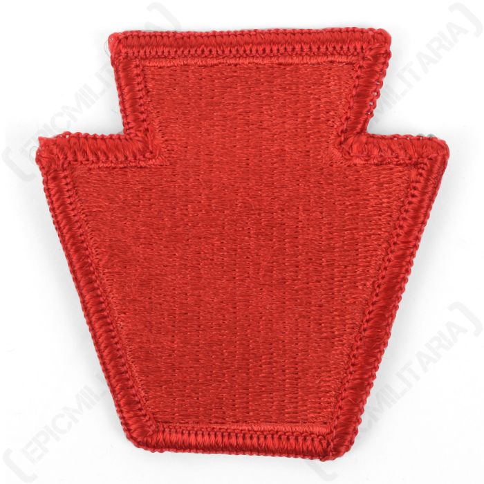 Front view of red keystone shaped patch