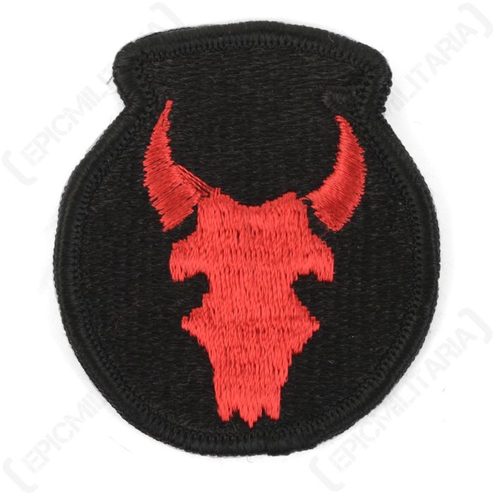 Front of black, circular embroidered patch with a red bull's head in the middle