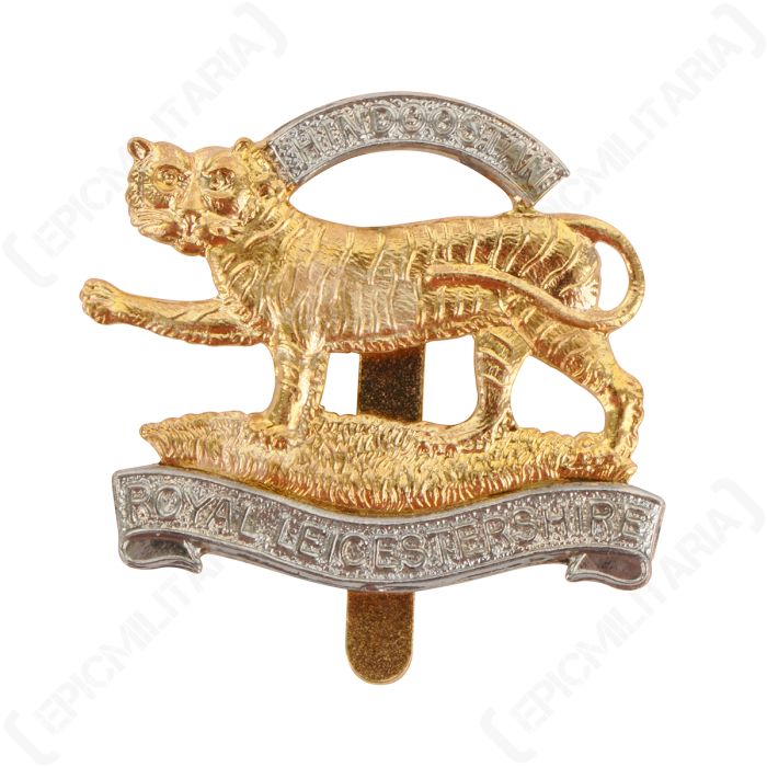 Front view of gold and silver badge worn by the Royal Leicester Regiment, featuring a tiger surrounded by banners with "Hindoostan Leicestershire" on them