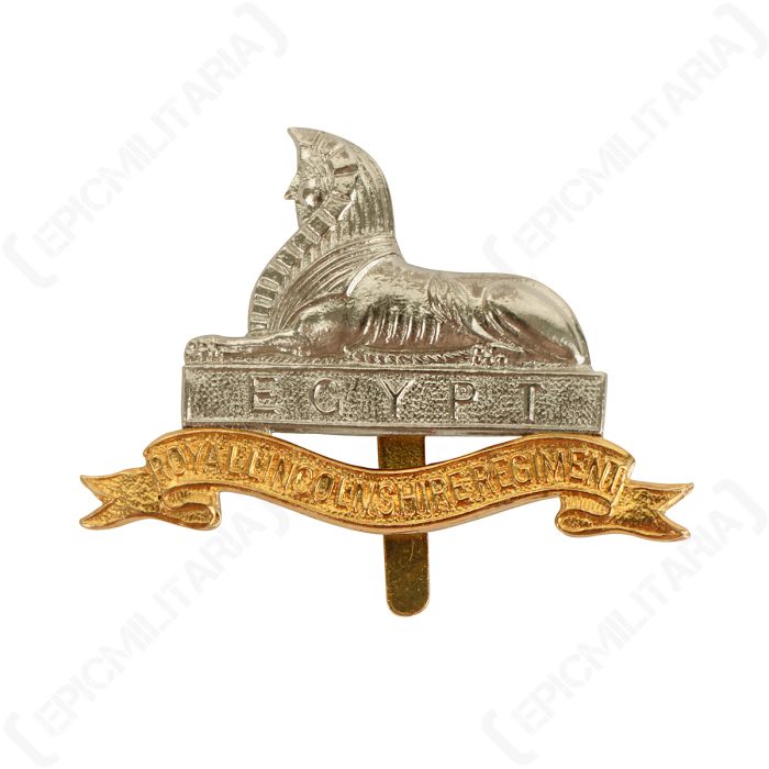 Front of British Royal Lincolnshire cap badge featuring a silver coloured sphinx above a gold colored scroll