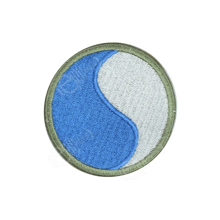 Circular embroidered half blue and half white insignia with khaki green outline - 29th Infantry Division
