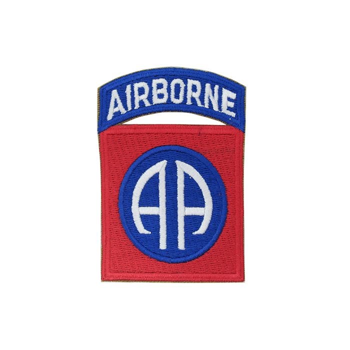 Red embroidered square with blue circle in the middle with AA in white. Above the red square is a blue embroidered arc with AIRBORNE embroidered in white