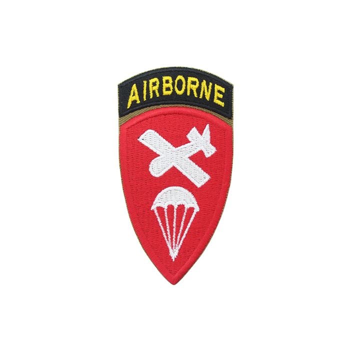 Shield shaped embroidered red patch with white plan and parachute silhouette in the middle, with a black embroidered arch attached to the top with AIRBORNE in yellow