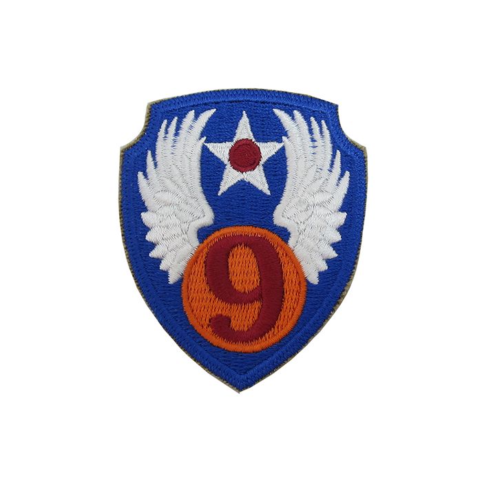 Blue shield shaped embroidered insignia with orange circle and the number 9 in red in the middle, with white wings - US 9th Airforce Badge/Patch