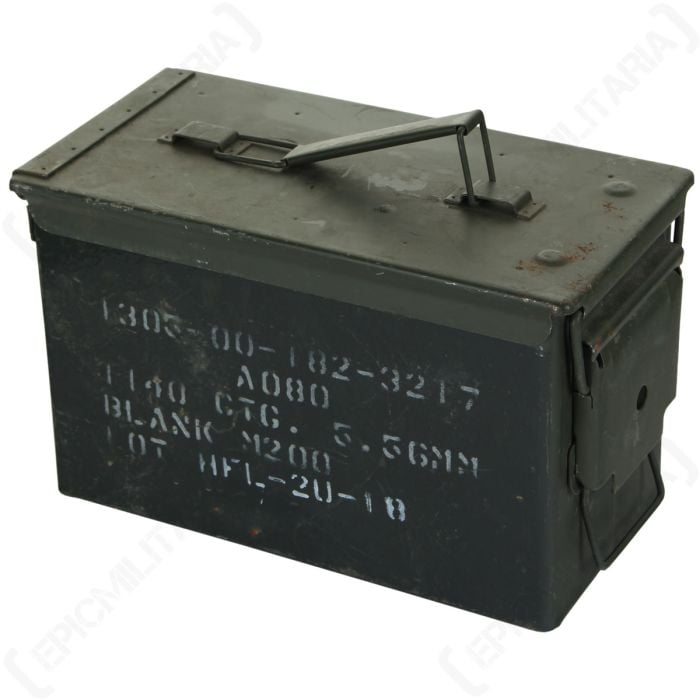 Side view of rectangular, olive drab, metal US Army 5.56mm ammo tin with white text stamped on the side