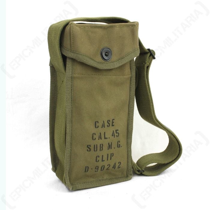 Side view of olive green rectangular US Thompson SMG 30rd Mag. Stick Carrier standing vertically, with olive green canvas strap