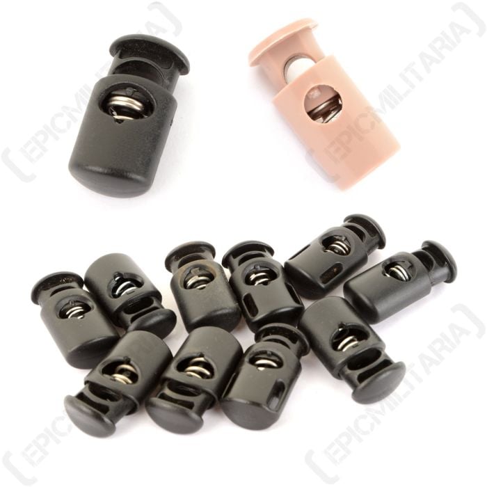 Top down view of handful of black and khaki plastic original british army toggles