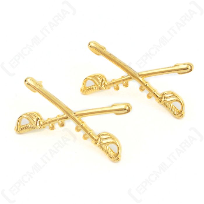 Front of pair of gold US Cavalry Branch Insignia