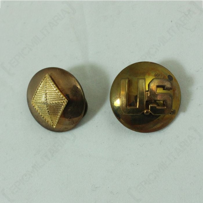 Pair of round, gold US Finance and Monogram Collar Discs, one with a diamond shape on the front, the other with US on the front