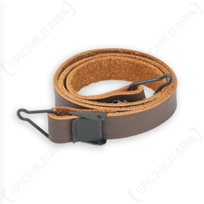 Rolled up brown leather US M1 1943 Pattern Chin Strap with grey buckle