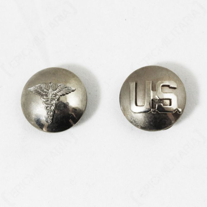Pair of round, faded US Medic and Monogram Collar Discs, one with the caduceus on the front and one with US on the front