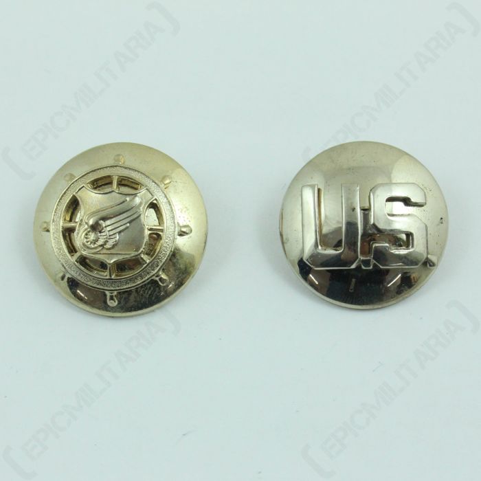 Pair of round, faded US Transportation Corps and Monogram Collar Discs, one with a shield in the middle of a helm and the other with US in the middle