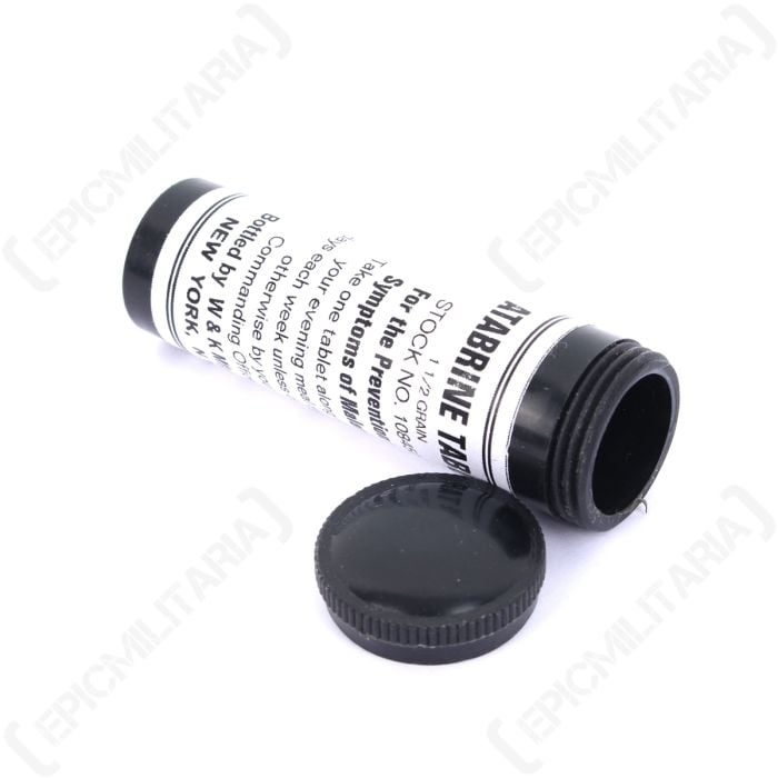 Black medicine style bottle with unscrewed top, with WW2 US Atabrine Vial label in white with black text stuck on it