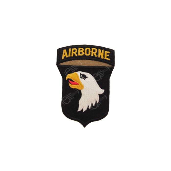 Shield shaped dark brown embroidered patch with right-facing eagle head, white with black eye, yellow beak, and red tongue. Attached to the top of the shield is a dark brown arch with AIRBORNE in golden yellow