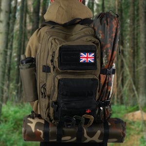 a MOLLE rucksack kitted out with equipment on someones back