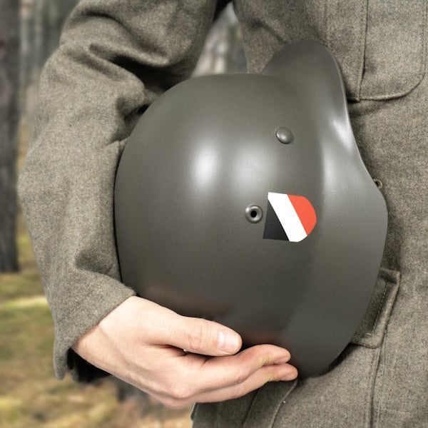 Picture of a custom german helmet under a soliders arm